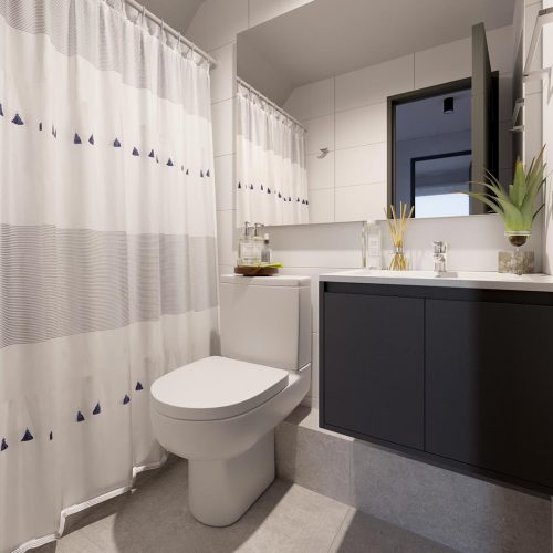 Baño con mueble vanitorio y espejo. Reserva Magallanes - casas en Punta Arenas